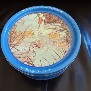 Vintage tin filled with sewing notions